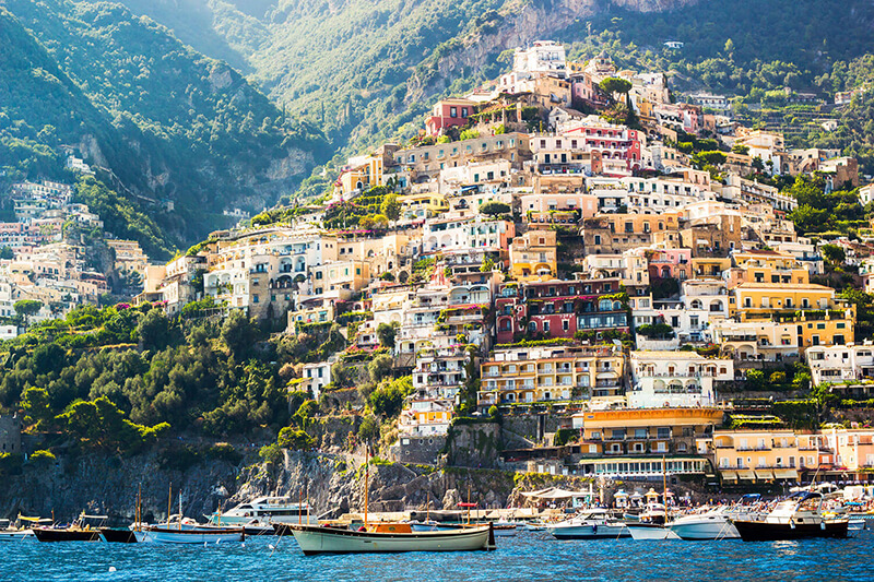 Breathtaking view of Capri Island and the Amalfi Coast, showcasing stunning cliffs and vibrant coastal scenery.